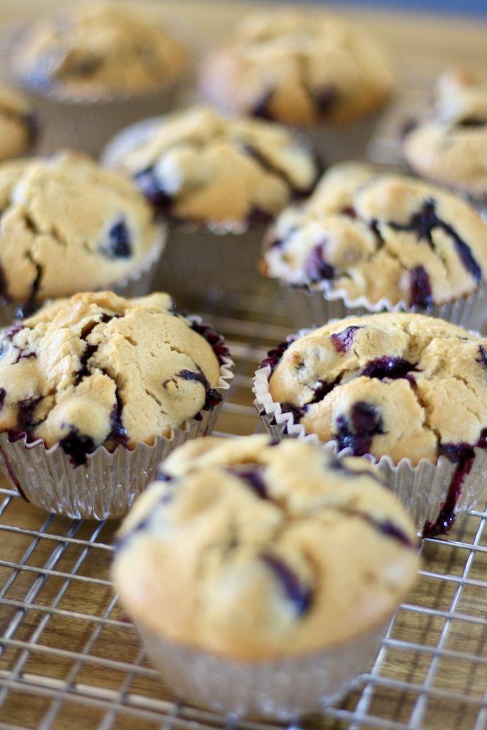 blueberry lemon muffins cooling on wire rack